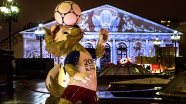 A photograph taken on December 11, 2017 shows the FIFA World Cup 2018 mascot Zabivaka in front of the Manege Exhibition Hall outside the Kremlin in Moscow. Images are projected on the facade of the Manege marking the Year of Ecology and the upcoming holdays. Mladen ANTONOV / AFP