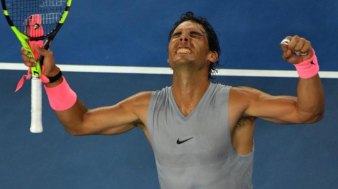 Spain’s Rafael Nadal celebrates after victory over Bosnia’s Damir Dzumhur after their men’s singles third round match on day five of the Australian Open tennis tournament in Melbourne on January 19, 2018. (AFP)