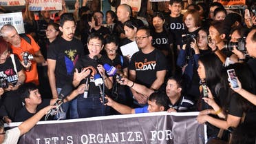 Maria Ressa (centre L-with microphone), the CEO and editor of online portal Rappler, speaks during a protest on press freedom along with fellow journalists in Manila. (AFP)