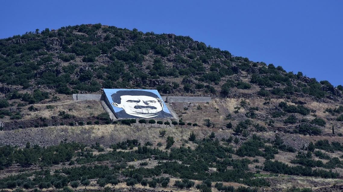 A picture taken on June 9, 2017 from the city of Afrin, along Syria's northern border with Turkey, shows a portrait of jailed Kurdish leader Abdullah Ocalan. (AFP)