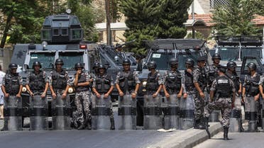 Jordanian security forces on guard before protesters near the Israeli embassy in Amman on July 28, 2017. (AFP)