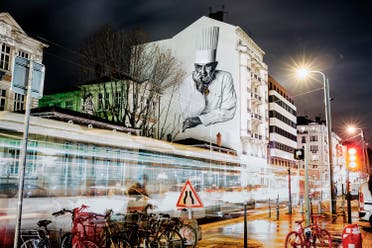 This file photo taken on December 21, 2015 shows a mural of French chef Paul Bocuse painted on the side of a building in Lyon, eastern France. (AFP)