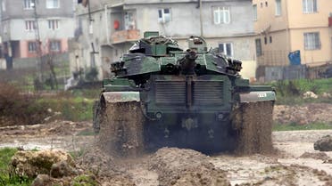 A Turkish army tank moves toward the Syrian border, in Reyhanlı, Turkey, Thursday, Jan. 18, 2018. (AP)