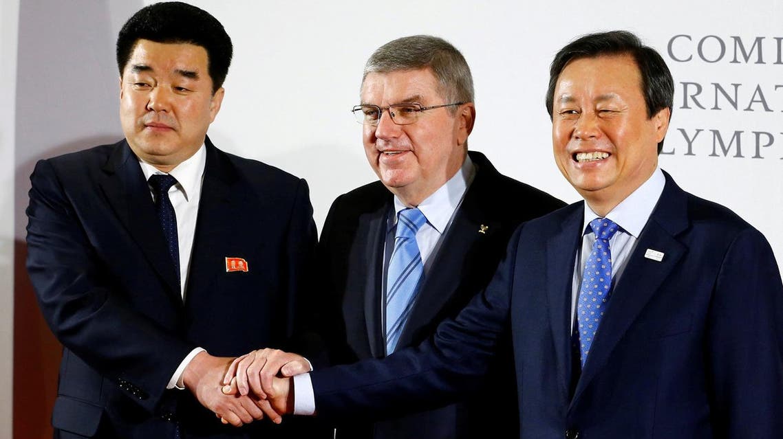 IOC President Thomas Bach welcomes the delegations of North and South Korea at the IOC headquarters in Lausanne. (Reuters)