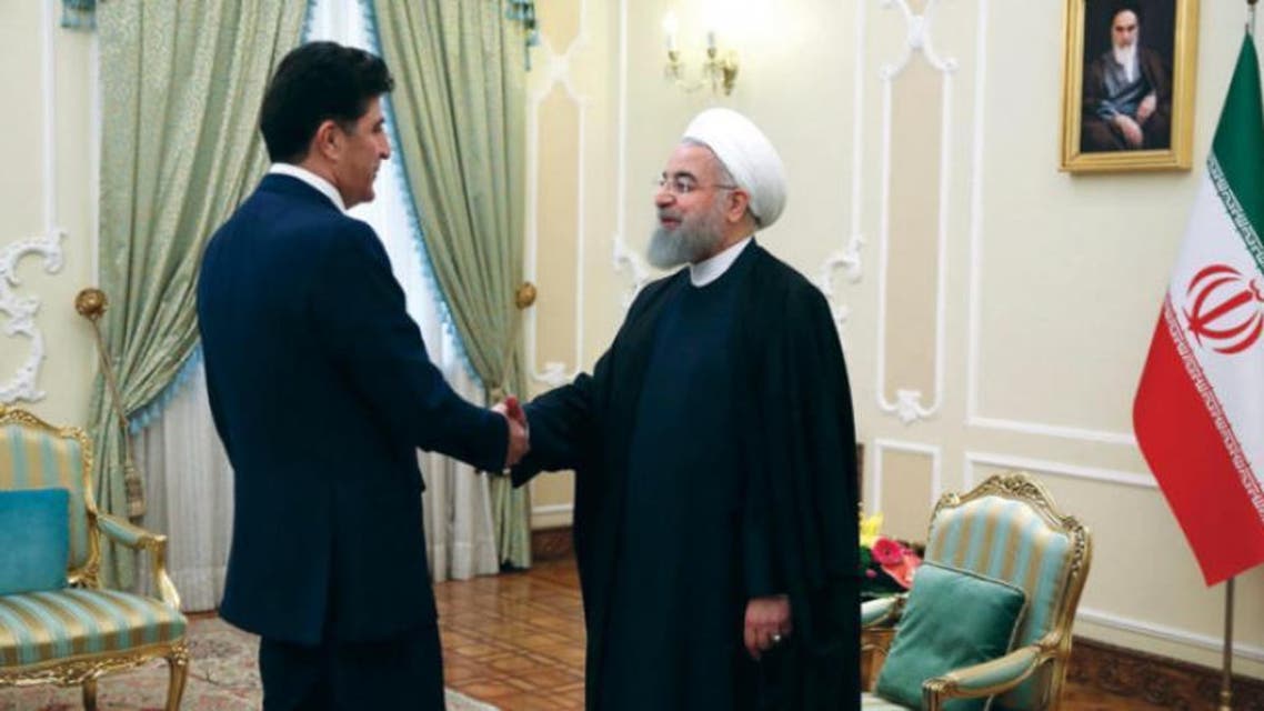 الرئيس الإيراني حسن روحاني لدى استقباله رئيس حكومة إقليم كردستان العراق نيجيرفان بارزاني