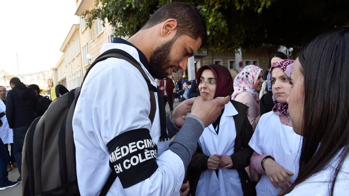 Algerian doctors who are completing their residency stage a sit-in at the Mustapha Bacha hospital in Algiers, on January 23, 2018, as part of a two-month-long strike protesting against compulsory civil service. RYAD KRAMDI / AFP