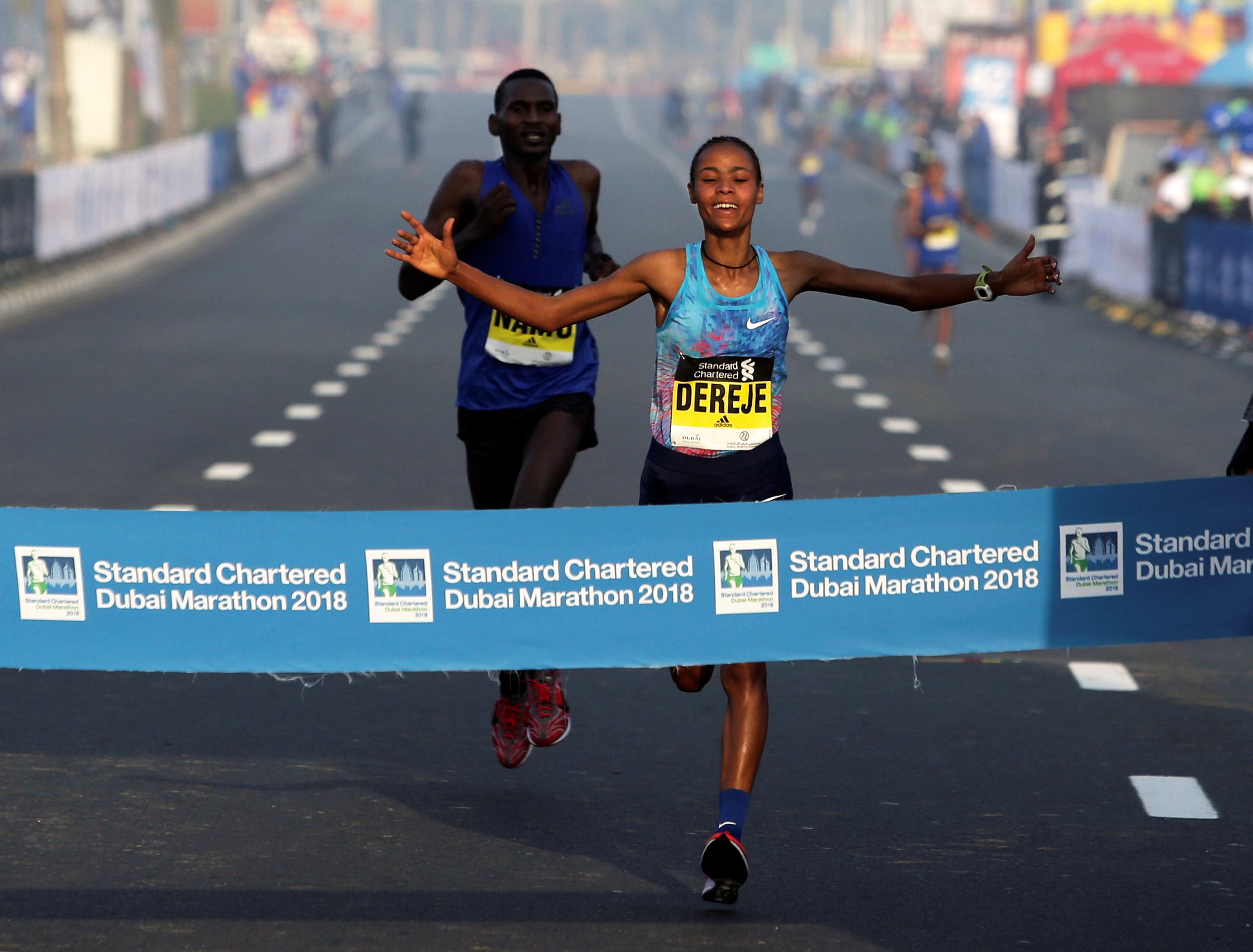 Roza Dereje Bekele of Ethiopia crosses the finish line of the Dubai Marathon, in Dubai, UAE January 26, 2018. REUTERS