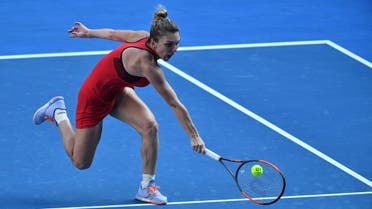Simona Halep hits a return against Angelique Kerber during their women's singles semi-finals match on day 11 of the Australian Open tennis tournament in Melbourne on January 25, 2018. (AFP)