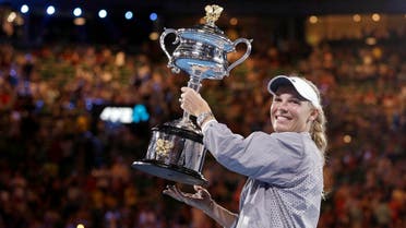 Caroline Wozniacki holds her trophy after defeating Simona Halep in the women’s singles final at the Australian Open tennis championships in Melbourne, on Jan. 27, 2018. (AP )