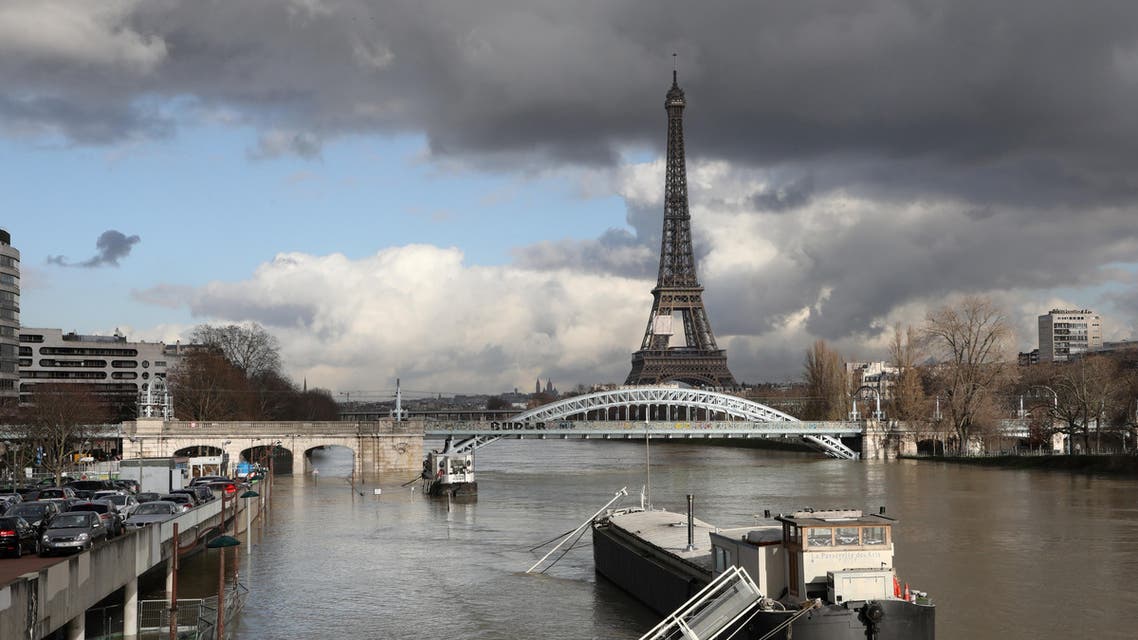 A picture taken on January 26, 2018, shows the flooded banks of the river Seine with the Eiffel Tower in the backround in Paris. (AFP)