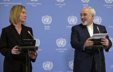 Iranian Foreign Minister Mohammad Javad Zarif and EU foreign policy chief Federica Mogherini hold a press conference in Vienna on January 16, 2016. (AFP)