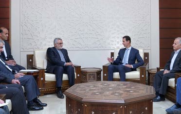 Syrian President Bashar al-Assad meets with the chairman of the Committee for Foreign Policy and National Security at the Iranian Shura Council Alaeddin Boroujerdi in Damascus on October 5, 2017.  LOUAI BESHARA / SANA / AFP