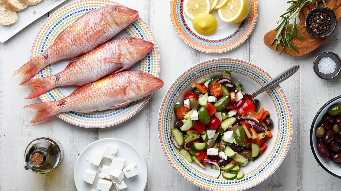Red mullet fish and mediterranean dishes cooking - Stock image...