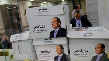 Members of President Sisi’s presidential campaign count boxes at the National Election Authority in Cairo on January 24, 2018. (Reuters)