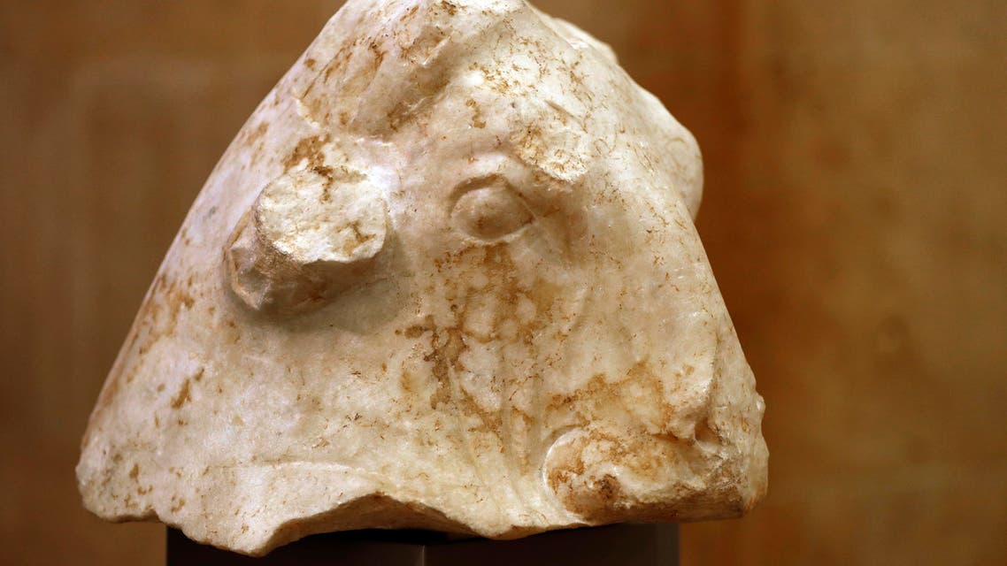 The ancient sculpture "Bull's Head" is displayed at the Lebanese National museum during a ceremony celebrating the return of three ancient sculptures from the United States, in Beirut, Lebanon, Friday, Feb. 2, 2018. The treasures once owned by private collectors and valued at more than $5 million US were ordered returned to Lebanon by the Manhattan district attorney. They were stolen from a temple during the Lebanese 1975-90 civil war and confiscated in New York in the past few months. (AP Photo/Hussein Malla)