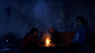 Palestinians warm themselves inside their house in the northern Gaza Strip January 31, 2018. (Reuters)