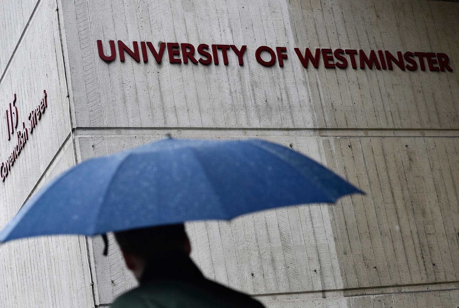 A man walks past a University of Westminster campus building in central London, February 26, 2015. (Reuters)