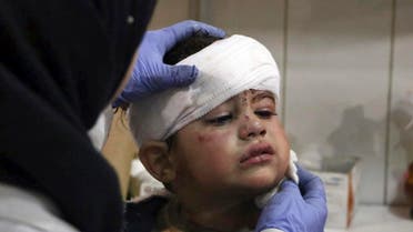 This photo provided by the Syrian anti-government activist group, Ghouta Media Center, GMC, which has been authenticated based on its contents and other AP reporting, shows an injured boy receiving treatment at a hospital in Hazeh in eastern Ghouta, the only remaining rebel stronghold near the capital, Damascus, Syria, Monday, Feb. 5, 2018. (AP)