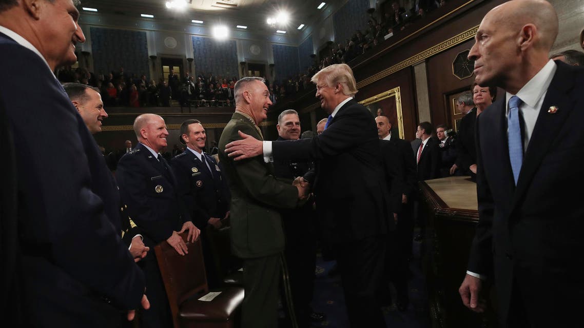 President Donald Trump greets Chairman of the Joint Chiefs of Staff Gen. Joseph Dunford after delivering his first State of the Union address in the House chamber of the U.S. Capitol to a joint session of Congress Tuesday, Jan. 30, 2018 in Washington. (Win McNamee/Pool via AP)