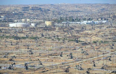Oil derricks are seen at the Chevron Oil Field in Bakersfield, California on November 21, 2016. (AFP)