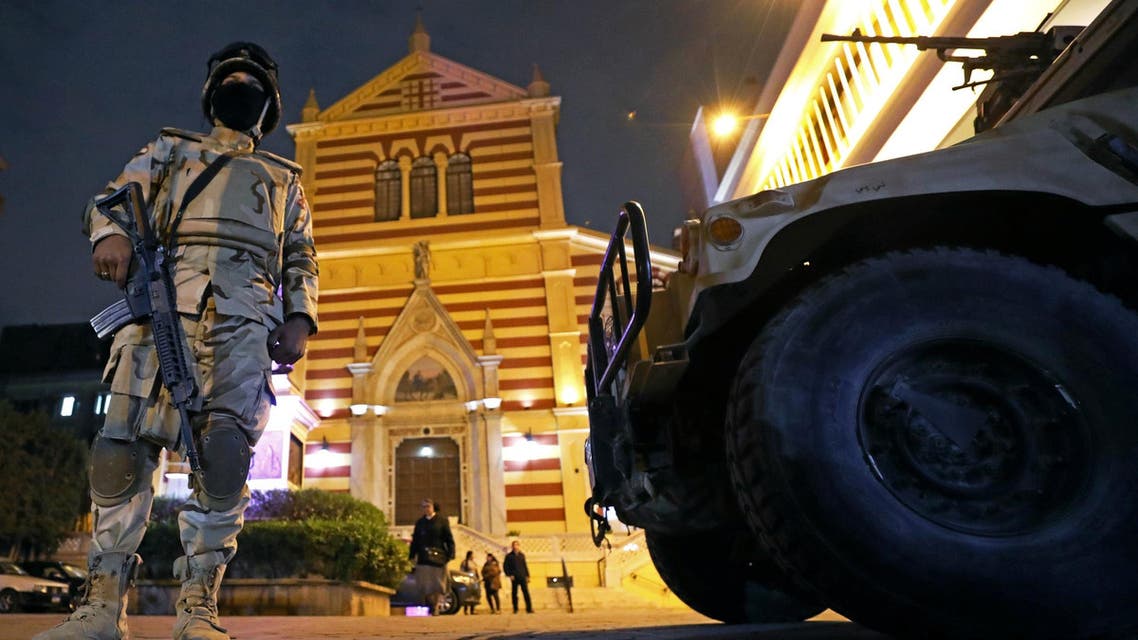 Egyptian army soldiers stand guard during a New Year’s Eve mass at Saint Joseph’s Roman Catholic Church in Cairo on December 31, 2017. (Reuters)