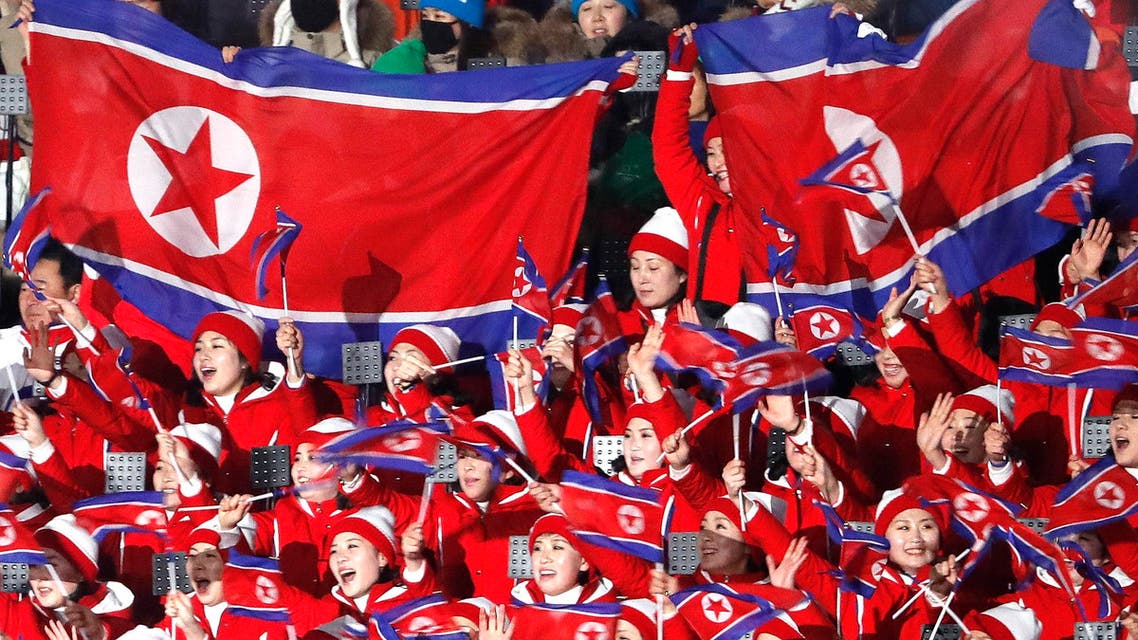 Pyeongchang 2018 Winter Olympics: Cheerleaders of North Korea wave their national flags as they wait the start of the opening ceremony. (Reuters)