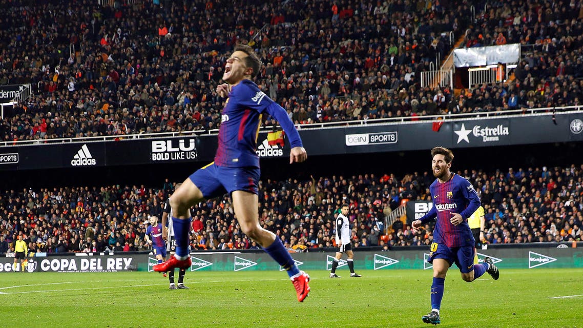 Colombian defender Yerry Mina made his Barcelona debut on Thursday by replacing Gerard Pique late in the match. Pique had been listed as doubtful because of a knee injury. FC Barcelona's Philippe Coutinho, left, celebrates after scoring against Valencia during the Spanish Copa del Rey, semifinal, second leg, soccer match between FC Barcelona and Valencia at the Mestalla stadium in Valencia, Spain, Thursday Feb. 8, 2018. (AP Photo/Alberto Saiz)