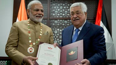 Palestinian President Mahmoud Abbas, (right) decorates Indian Prime Minister Narendra Modi with the Grand Collar of the State of Palestine medal, during his visit to the Palestinian Authority headquarters in the West Bank city of Ramallah, on Saturday, Feb. 10, 2018. (AP)