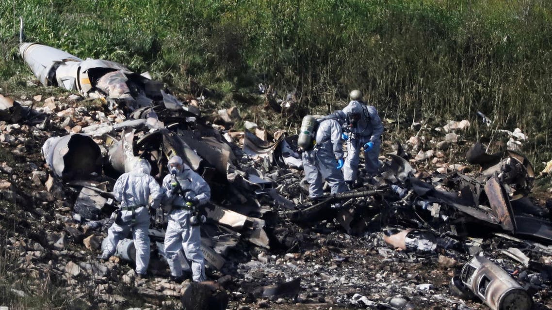 Israeli security forces examine the remains of an F-16 Israeli war plane near the village of Harduf. (Reuters)
