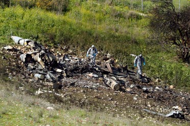 A picture taken in the northern Israeli Kibbutz of Harduf on February 10, 2018, shows the remains of an Israel F-16 that crashed after coming under fire by Syrian air defences during attacks against Iranian targets in the war-torn country. (AFP)
