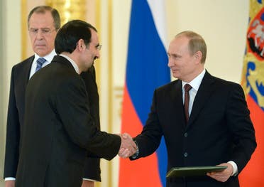 Russia's President Vladimir Putin (R) shakes hands with Iran's ambassador to Russia, Mehdi Sanai, during a ceremony of receiving foreign ambassadors' credentials. (File photo: AFP)
