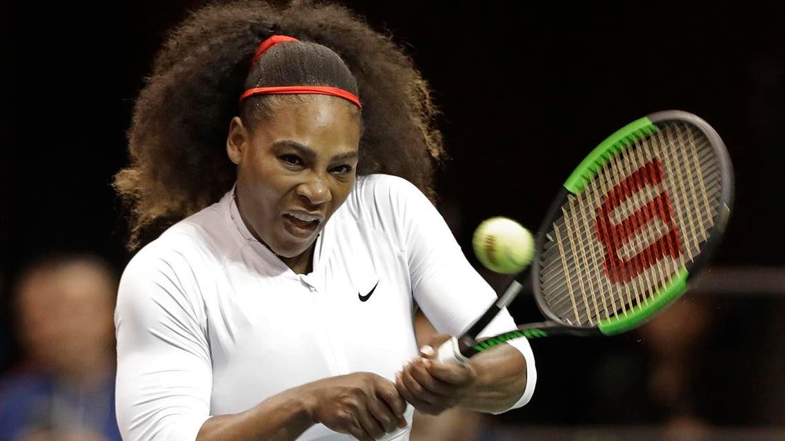 USA's Serena Williams returns a shot against the Netherlands during a doubles match in the first round of Fed Cup tennis competition. (AP)