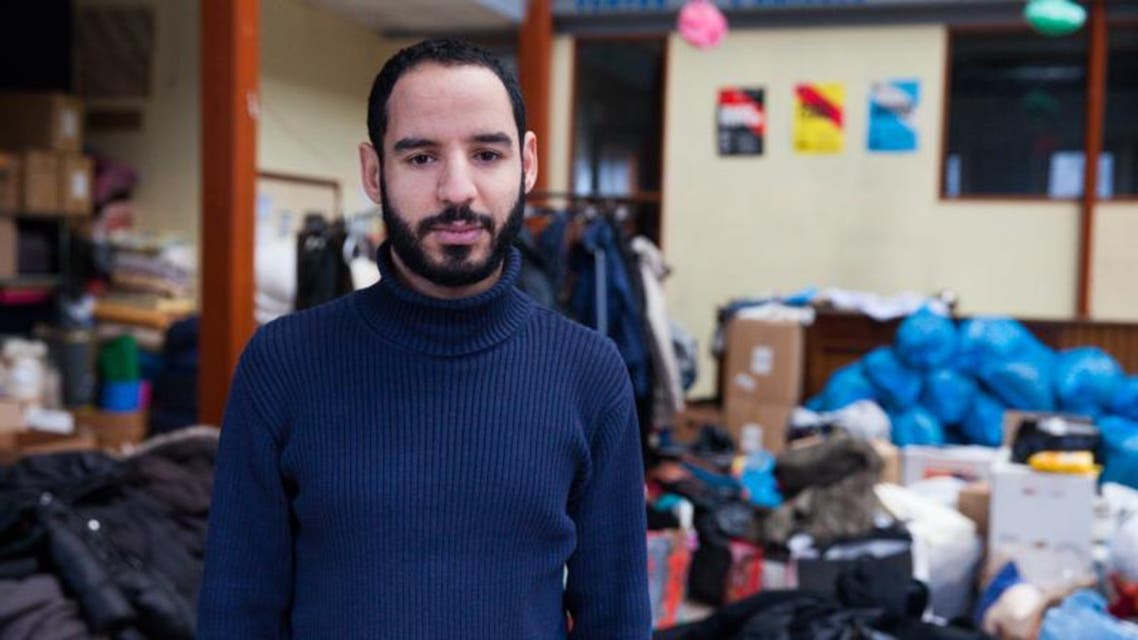 Nabil in the hangar where he collects all the clothes and the food for migrants. (Ghassen Fridhi/Al Arabiya)