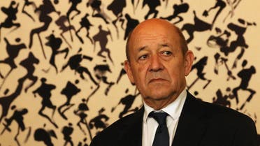 France's Foreign Minister Jean-Yves Le Drian stands in front of artwork by late Korean-born painter Lee Ungno as he attends a ceremony at the French embassy in Seoul on February 11, 2018 to launch the construction of a new embassy building. Le Drian, who attended the opening ceremony of the Pyeongchang 2018 Winter Olympic Games on February 9, is on the last day of his three-day visit. Sebastien BERGER / AFP