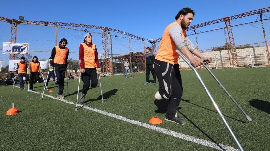 Syrian amputees who were injured in the war warm up for a football match organised by a centre for physical therapy in Idlib, the last province in the country outside government control, on January 15, 2018
