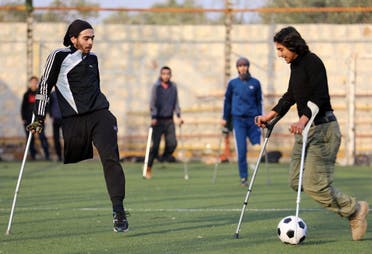 Syrian amputees who were injured in the war warm up for a football match organised by a centre for physical therapy in Idlib, the last province in the country outside government control, on January 15, 2018