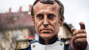 A carnival float, depicting a caricature of French President Emmanuel Macron in Napoleon pose, is pictured during a carnival parade on Rose Monday on February 12, 2018 in Mainz, western Germany.  (AFP)