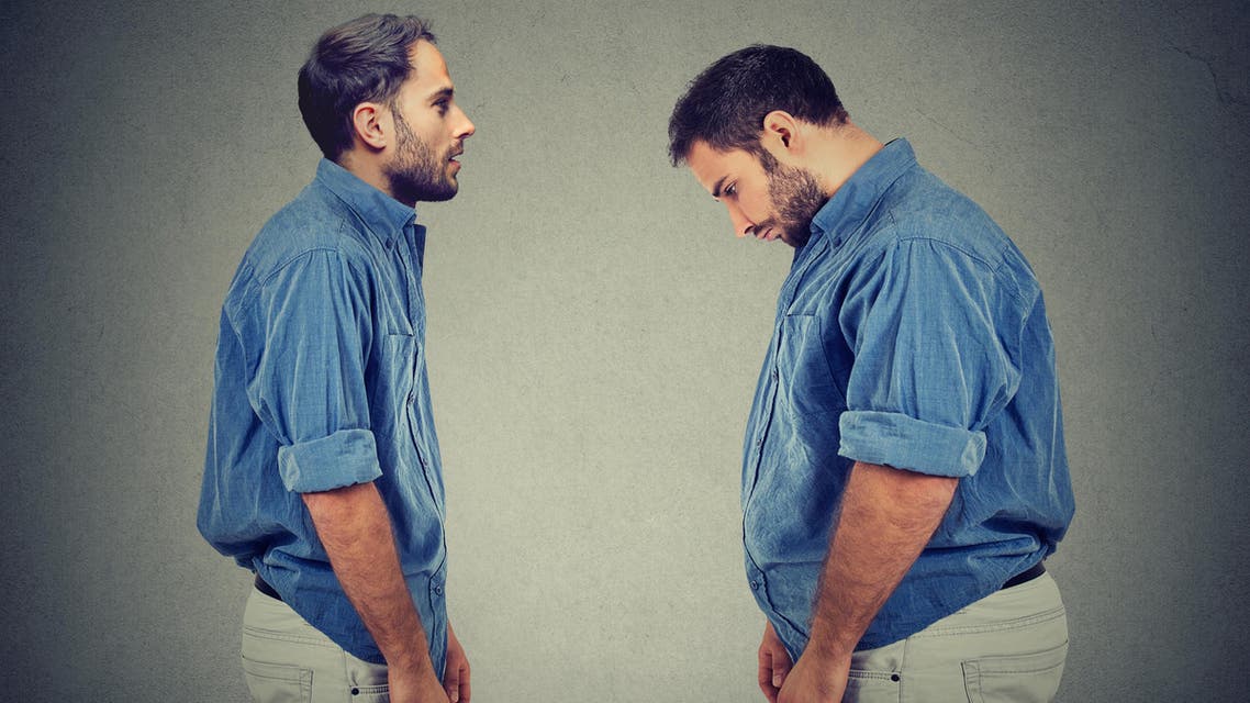 Slim guy looking at fat man himself. Diet choice right nutrition concept - Stock image...