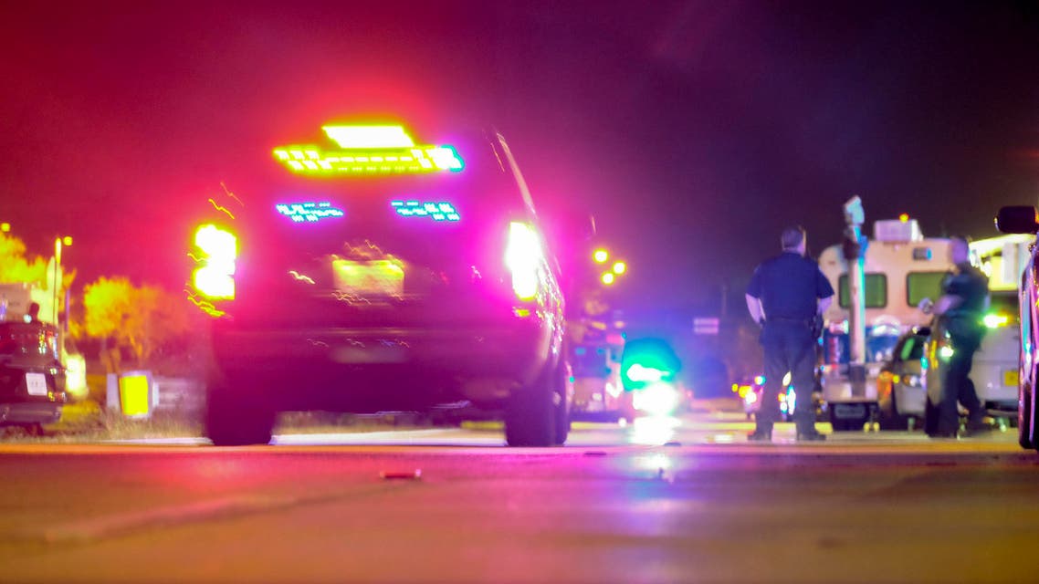 Police vehicles block the road to Marjory Stoneman Douglas High School in Parkland, Florida, following the shooting on February 14, 2018. (AFP)
