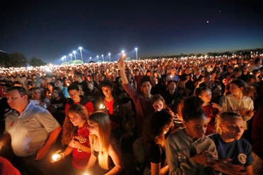 People hoist up their candles during a vigil for the victims of the Wednesday shooting at Marjory Stoneman Douglas High School, in Parkland, Fla., on Feb. 15, 2018. (AP)