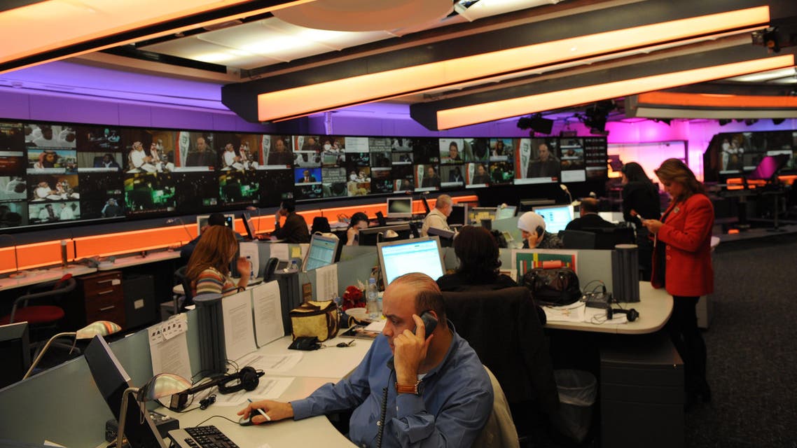 Journalists work at Al Arabiya headquarters at Dubai Media City on December, 15 2009. (AFP)