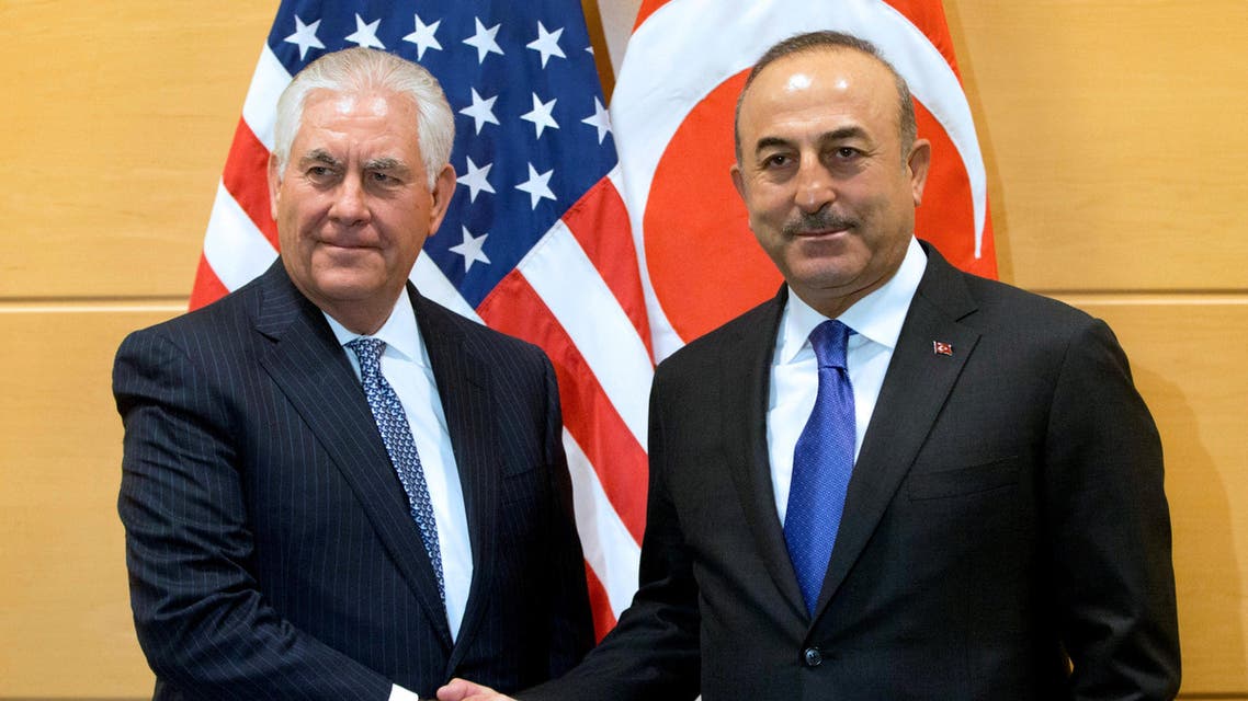 U.S. Secretary of State Rex Tillerson poses with Turkish Foreign Minister Mevlut Cavusoglu during a NATO foreign ministers meeting at the Alliance headquarters in Brussels, Belgium, December 6, 2017. REUTERS/Virginia Mayo/Pool