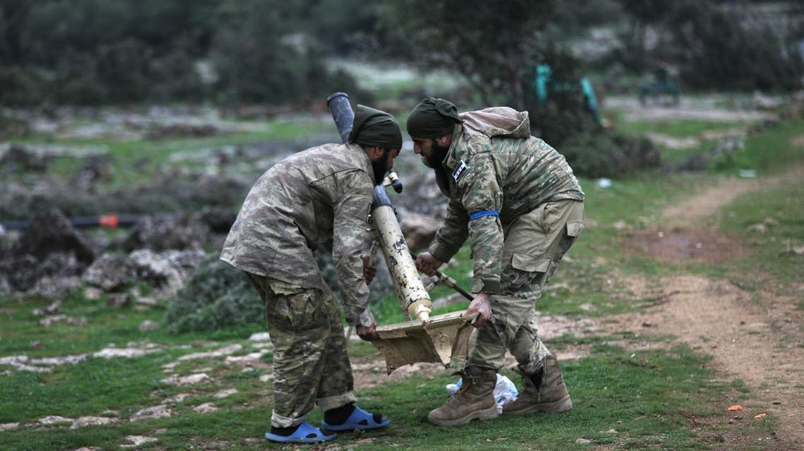 Turkish-backed Free Syrian Army fighters hold a mortar outside of Afrin, Syria February 17, 2018. (Reuters)