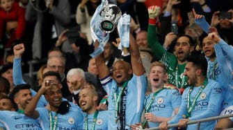 Man City win English League Cup soccer with 3-0 win over Arsenal