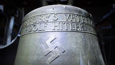 Nazi-era church bell that bears a swastika and the words "All for the Fatherland — Adolf Hitler" ("Alles fuer's Vaterland - Adolf Hitler") hanging in the steeple of the St Jakob church in Herxheim am Berg. (AFP