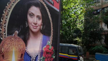 Indian policemen guard near a picture of Sridevi outside her residence in Mumbai on Feb. 27, 2018. (AP)