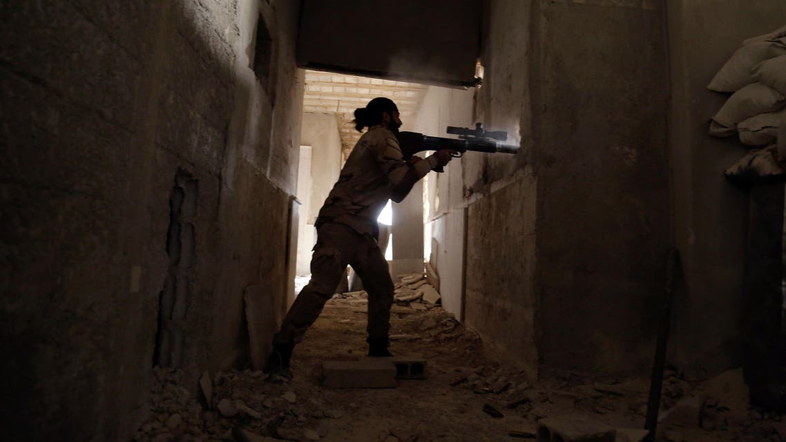 A Syrian rebel fighter fires a weapon in the eastern Ghouta area on July 17, 2017. (AFP)