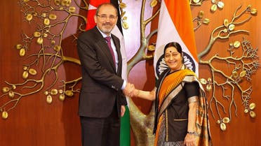 Jordan’s Foreign Minister Ayman Safadi (L) shakes hands with his Indian counterpart Sushma Swaraj in New Delhi on December 28, 2017. (Reuters)
