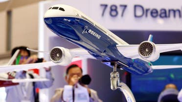 Visitors take pictures of a model of Boeing's 787 Dreamliner during Japan Aerospace 2016 air show in Tokyo, Japan, October 12, 2016. (Reuters)