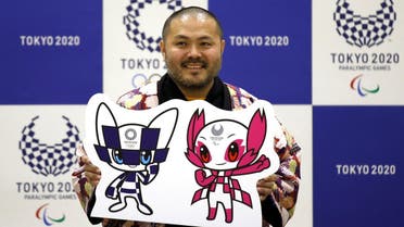 The designer of winning mascots Ryo Taniguchi poses for a photograph during a news conference after Tokyo Olympics organizers unveiled the mascots for the Tokyo 2020 Olympics and Paralympics. (Reuters)